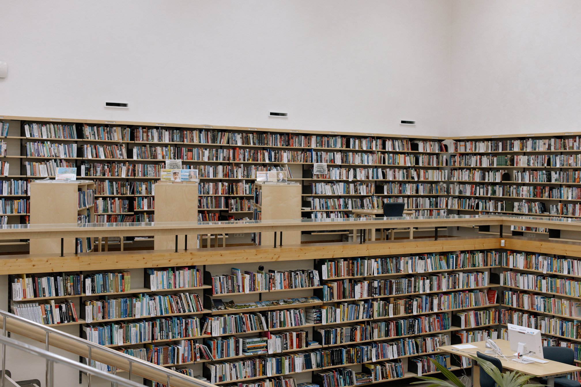 Books on Brown Wooden Shelves